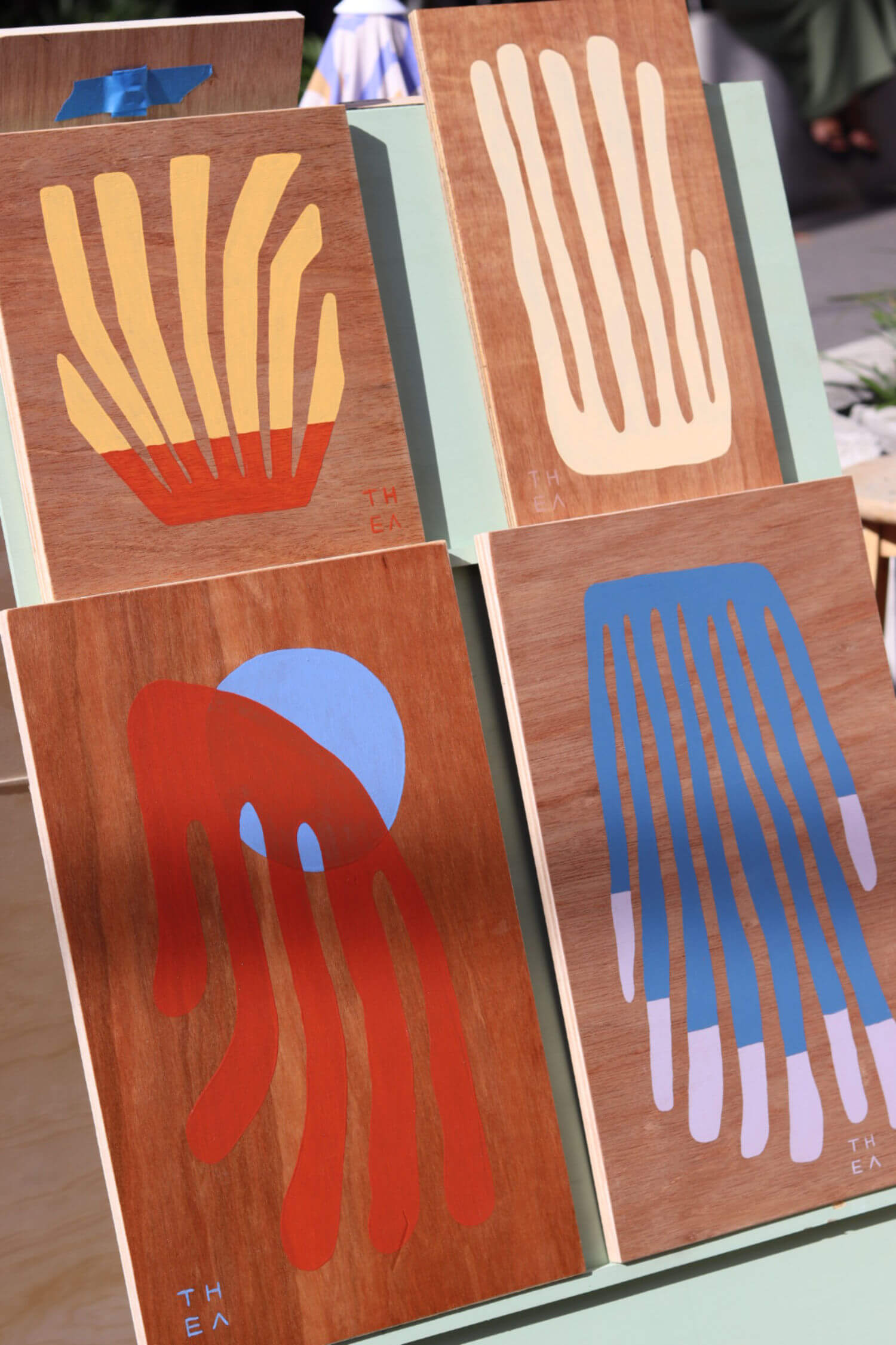 Painted art blocks at The Market Folk markets for Brisbane creatives.