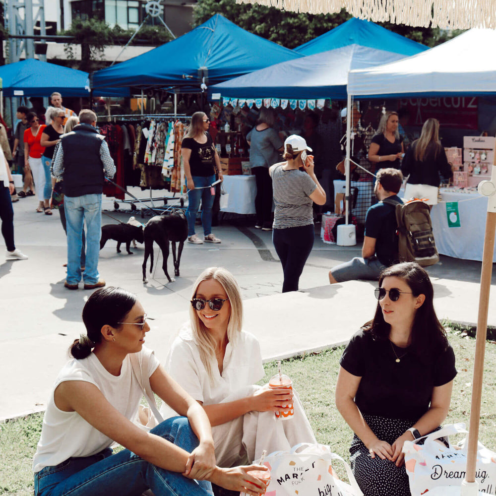 Three women enjoying The Market Folk Brisbane outdoor markets. Markets for creative small businesses Brisbane.